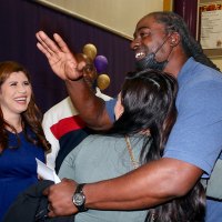 Hall of Fame Inductee David Ausberry, an all around athlete at Lemoore High School, greets friends.